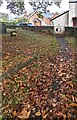 SO4520 : Leaf-strewn churchyard, Skenfrith, Monmouthshire by Jaggery