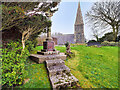 SH4468 : Llangaffo War Memorial and Church of St Caffo by David Dixon