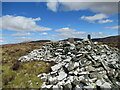 NX9099 : Trig pillar and summit shelter, Bellybought Hill by Alan O'Dowd