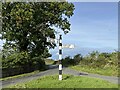 NY4363 : Signpost at Burnhill by Adrian Taylor