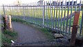 NY1442 : Stone gatepost beside footpath around school playing field by Roger Templeman