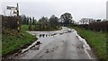 NY1540 : Two T-junctions on road towards West Fitz with finger signposts by Roger Templeman