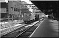 SJ8399 : West-bound goods train passes through Manchester Victoria Station by Martin Tester