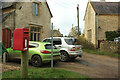 SP2812 : Postbox and houses, Swinbrook by Derek Harper