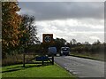 NZ1648 : Village sign by Robert Graham