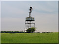 SP1403 : Barley Field and Windpump near Quenington by Pam Brophy