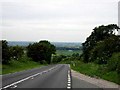 SE9234 : The B1230 Descending from High Hunsley by Roger Gilbertson