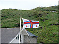 SX0486 : RNLI flag at Trebarwith by John Lucas