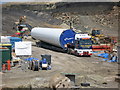 SD8118 : Turbine Tower Section Delivery  Passing Through Scout Moor Quarry. by Paul Anderson