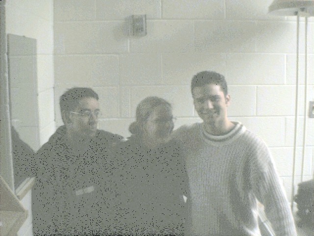 Grainy photo of three Canadian students.