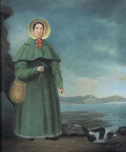 Posthumous painting of Anning by B. J. Donne from 1847, based on the 1842 portrait, showing her pointing at an ammonite.