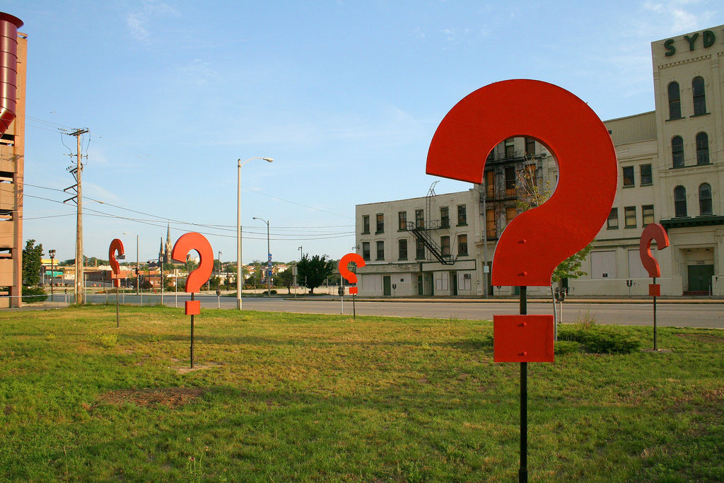 Some giant question marks standing in a field. Photo by https://www.flickr.com/photos/dbrekke/181939582/