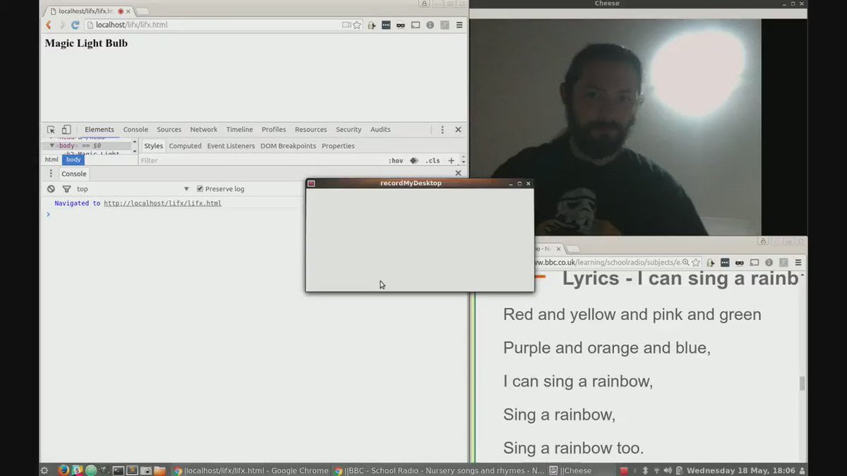 Screenshot. In one corner of my screen is a browser, one is a webcam view of me, one contains HTML output, one contains a debug console.