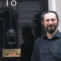 Terence Eden standing outside Number 10 Downing Street.