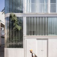 Trees grow through glazed facade of Tel Aviv homes by Paritzki & Liani