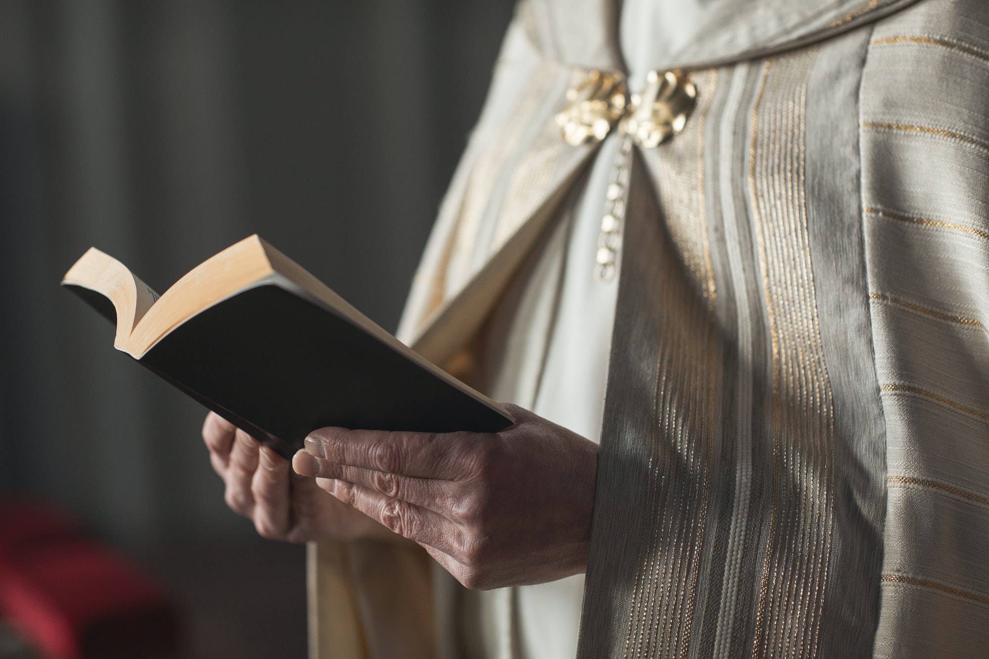 Priest reading prayers at ceremony