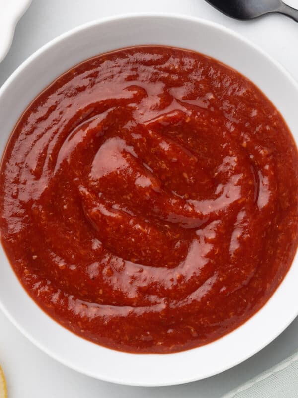 overhead closeup of cocktail sauce in a white bowl