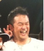 A Japanese man laughing