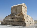 A small step pyramid like structure with a house-shaped structure on top.