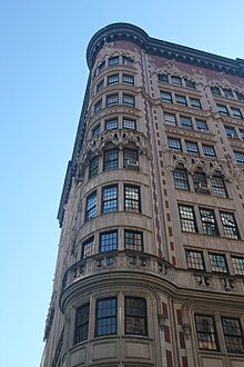 Architectural detail of the building's curved corner