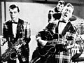 Image 3Bill Haley and his Comets performing in the 1954 Universal International film Round Up of Rhythm (from Rock and roll)