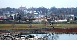 Kaukauna's south side downtown, as seen from Statue Park. The Fox River is in the foreground and the Civic Center is on the far right.