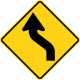 U.S. and Canada sharp reverse curves ahead sign.