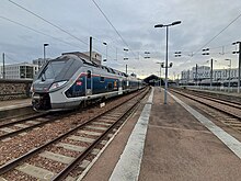 Photo avec un train TER à quai.