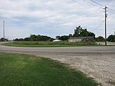 Looking north, FM 1301 can be seen at both the right and left side of the photo at the hairpin turn.