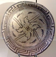 The Samarra bowl, from Iraq, circa 4,000 BCE, held at the Pergamonmuseum, Berlin. The swastika in the centre of the design is a reconstruction.[83]