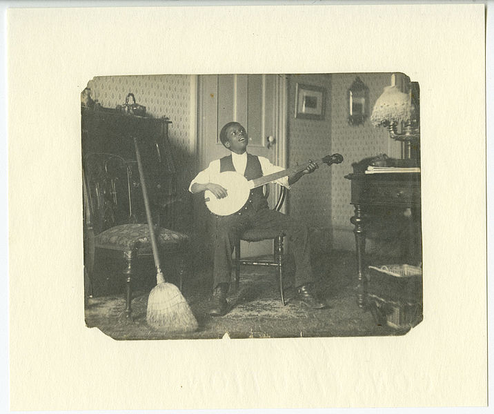 File:African American youth playing banjo (19584375341).jpg