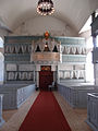 Røros Church with royal balcony and insignia of the copper mine