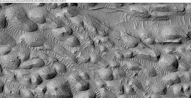 Layers and a field of small mounds, east of Gale Crater