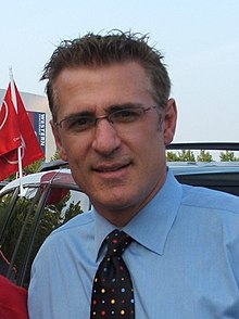 Man wearing glasses and a suit and tie