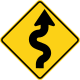 U.S. and Canada winding road ahead sign.