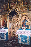 Gilded royal doors carved to represent the tree of life (old wooden church in Chotyniec, Poland).