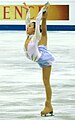 Cross-grab one-hand Biellmann spiral (Mao Asada)