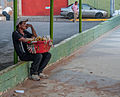 * Nomination Sad itinerant seller of sweets --The Photographer 12:42, 4 March 2013 (UTC) * Decline Subject too dark and noisy, composition spoiled by the man and car at right -- Alvesgaspar 14:18, 4 March 2013 (UTC)