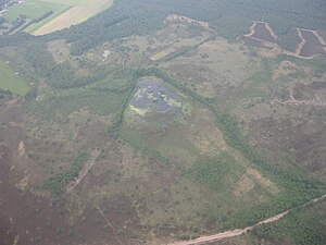 De Hapertse- en Cartierheide, gelegen nabij de plaatsen Eersel en Hapert, grenzend aan de Belgische grens en waar de gloeiige volgens orale traditie onder anderen rond zou spoken.