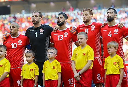 لاعبو المنتخب التونسي يغنون النشيد الوطني التونسي قبل مباراتهم ضد بلجيكا في كأس العالم 2018.