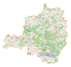 Mapa konturowa powiatu bełchatowskiego, blisko prawej krawiędzi nieco na dole znajduje się punkt z opisem „Spólne”