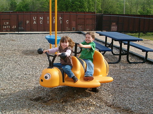 Children enjoying playground equipment