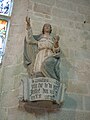 Le Faouët (Morbihan): chapelle Sainte-Barbe, statue et inscription sur la console portant la date du début de la construction de la chapelle (1489)