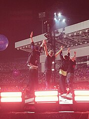 Coldplay preparing to bow on stage after performing