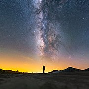 Third place: Milky Way lying above a lady, at Trona Pinnacles National Landmark, California. – Atribuim: Ian Norman (http://www.lonelyspeck.com)(cc-by-sa-2.0)