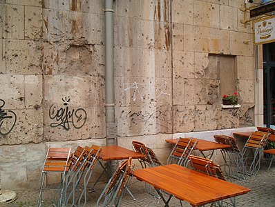 A Sidewalk Cafe Demonstrating Some History Next to Train Tracks in Berlin