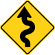 U.S. and Canada winding road ahead sign. (opposite direction)