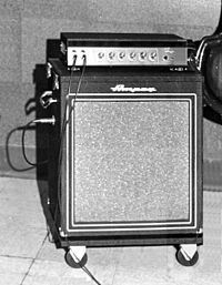 A 1950s era amplifier unit sitting on top of a bass speaker cabinet.