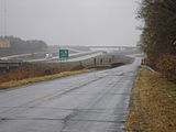 This frontage road along a rural freeway in Missouri (locally called an outer road) does not connect directly to the freeway and even dead ends in some places. highway=residential or highway=unclassified Not side_road=*