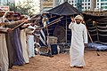 Image 13A band performs the Ayyala, which is a cultural dance derived from Arab tribes sword battles. (from Culture of the United Arab Emirates)